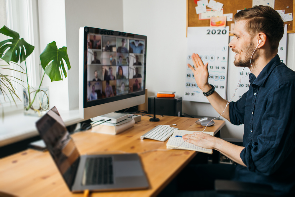 A man playing a Zoom icebreaker at the start of a kickoff meeting.